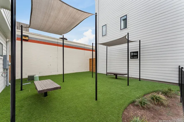 a view of backyard with sitting area