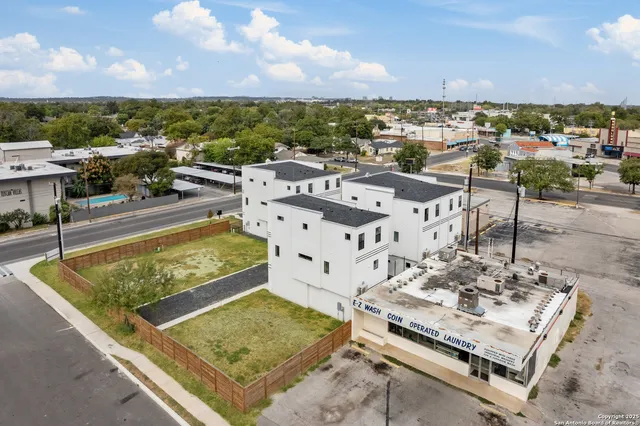 an aerial view of a multi story parking space