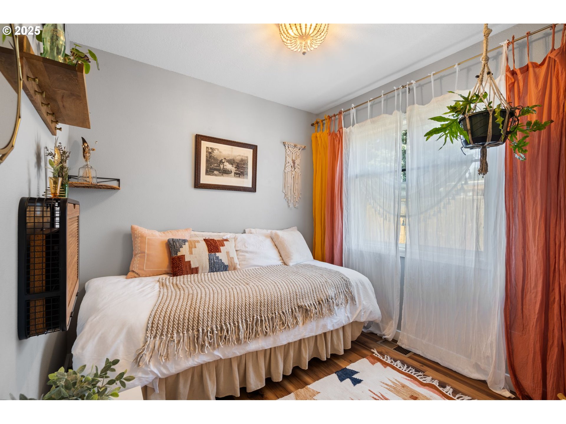 4517 Northeast 85th Avenue Portland, OR 97220 - Photo 14 of 38 a bedroom with a bed table and a potted plant