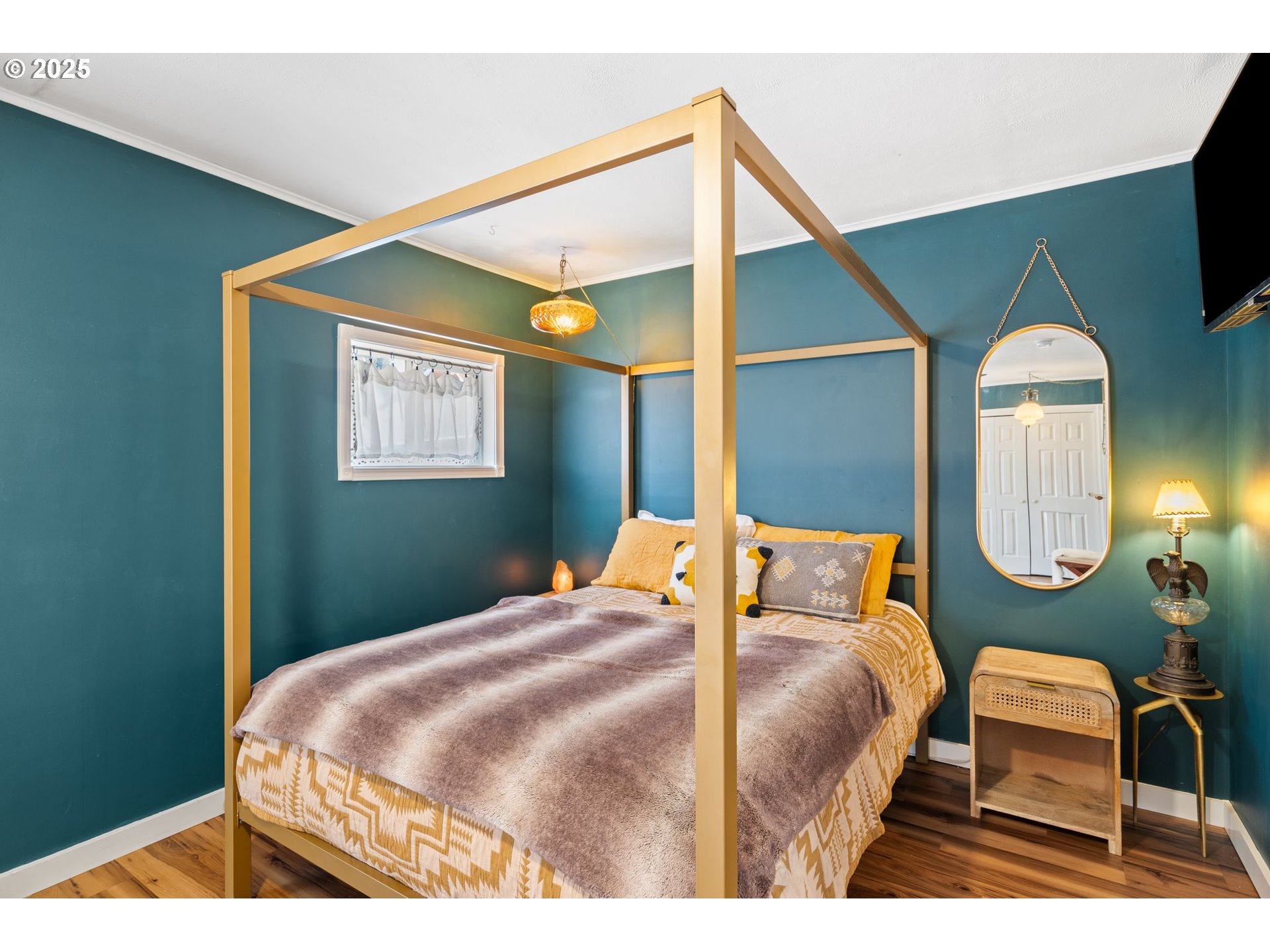 4517 Northeast 85th Avenue Portland, OR 97220 - Photo 20 of 38 a bedroom with a bed lamp and a potted plant