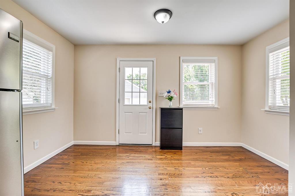 119 Wagner Street Edison, NJ 08837 - Photo 16 of 41 an empty room with wooden floor and windows