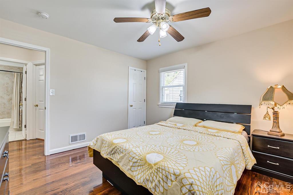 119 Wagner Street Edison, NJ 08837 - Photo 19 of 41 a bedroom with a bed and wooden floor