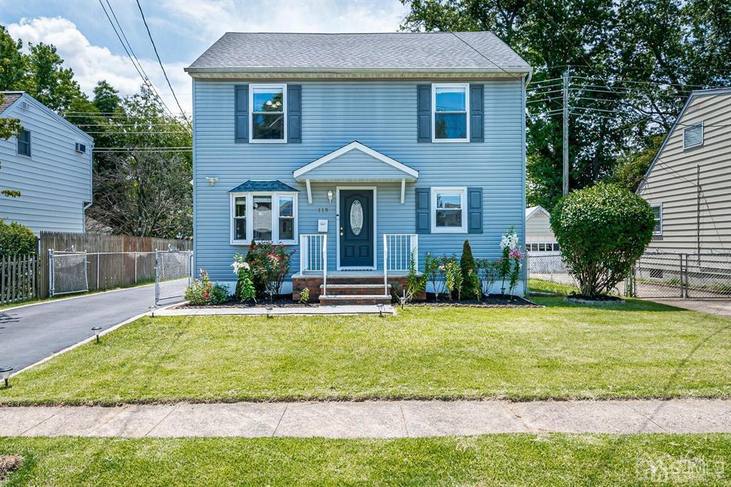 119 Wagner Street Edison, NJ 08837 - Photo 2 of 41 a front view of a house with a yard and potted plants
