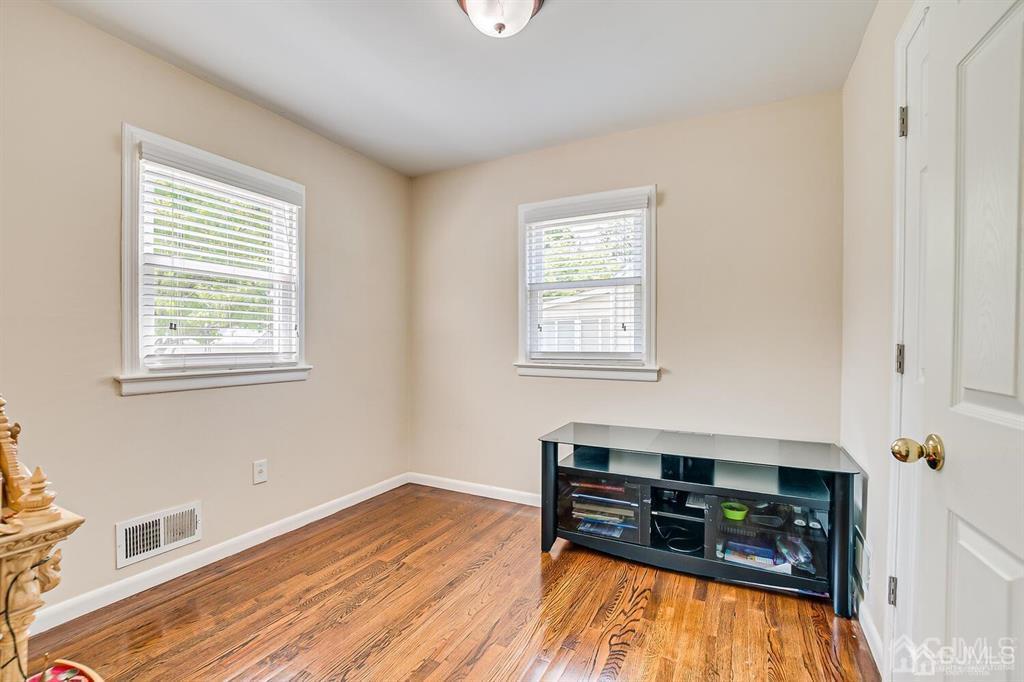 119 Wagner Street Edison, NJ 08837 - Photo 22 of 41 a room with furniture and a wooden floor