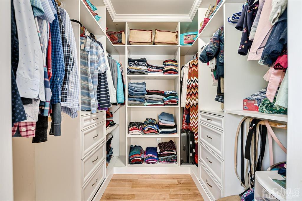 119 Wagner Street Edison, NJ 08837 - Photo 27 of 41 a view of walk in closet with clothes and shoes