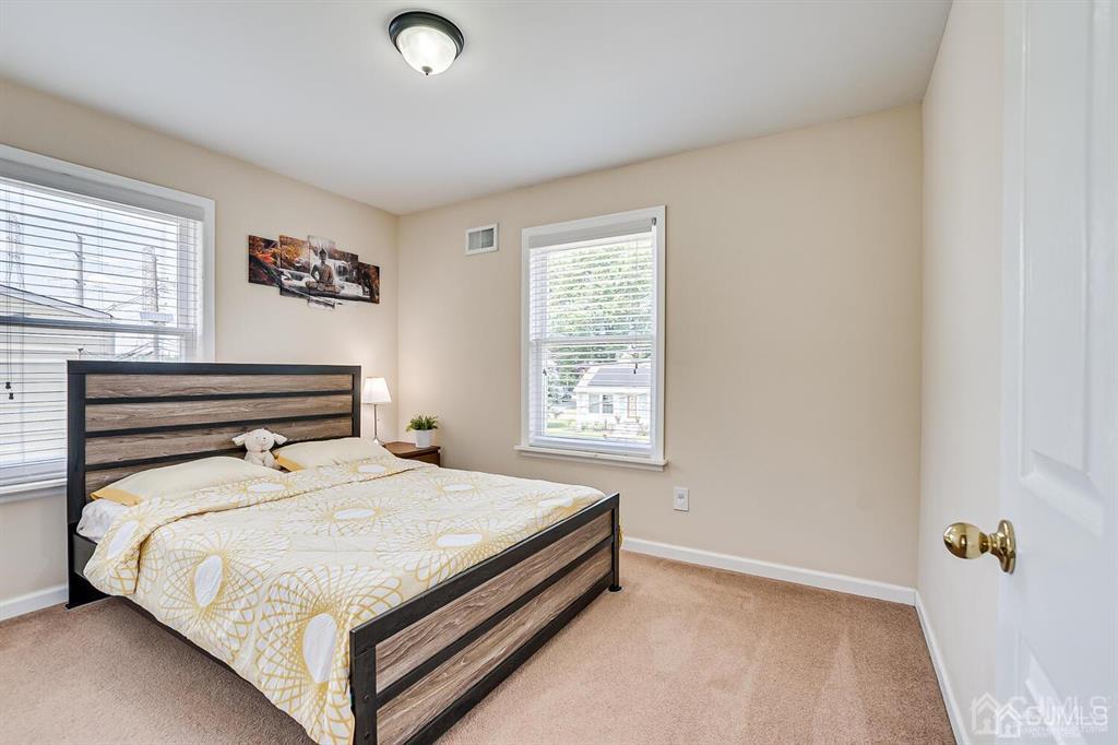 119 Wagner Street Edison, NJ 08837 - Photo 29 of 41 a bedroom with a bed and a window