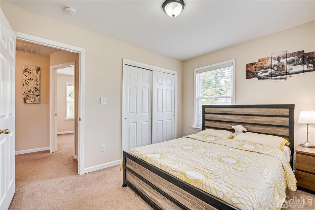 119 Wagner Street Edison, NJ 08837 - Photo 30 of 41 a bedroom with a bed and a window