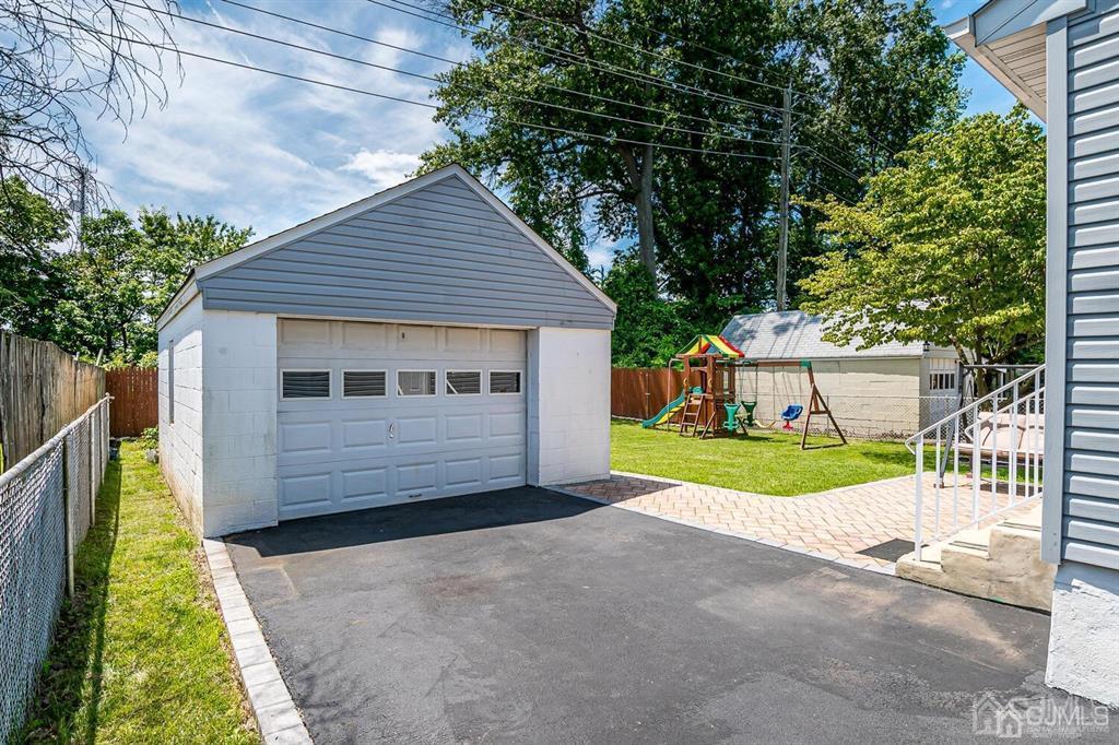 119 Wagner Street Edison, NJ 08837 - Photo 35 of 41 a front view of a house with a yard and garage