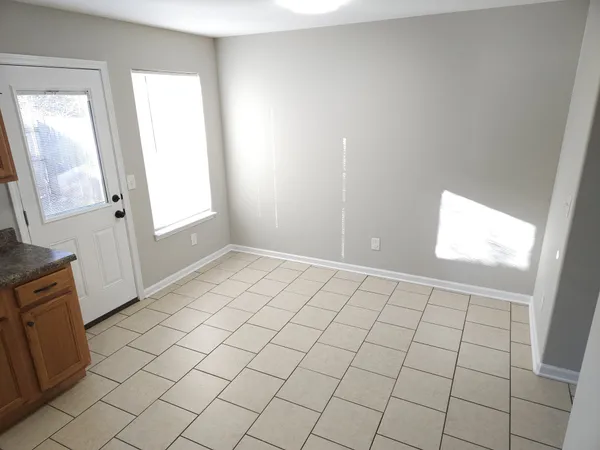 a view of an empty room and window