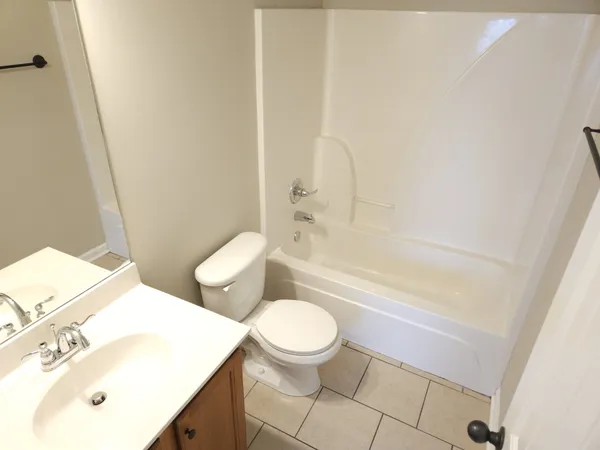 a bathroom with a sink a toilet and a bathtub