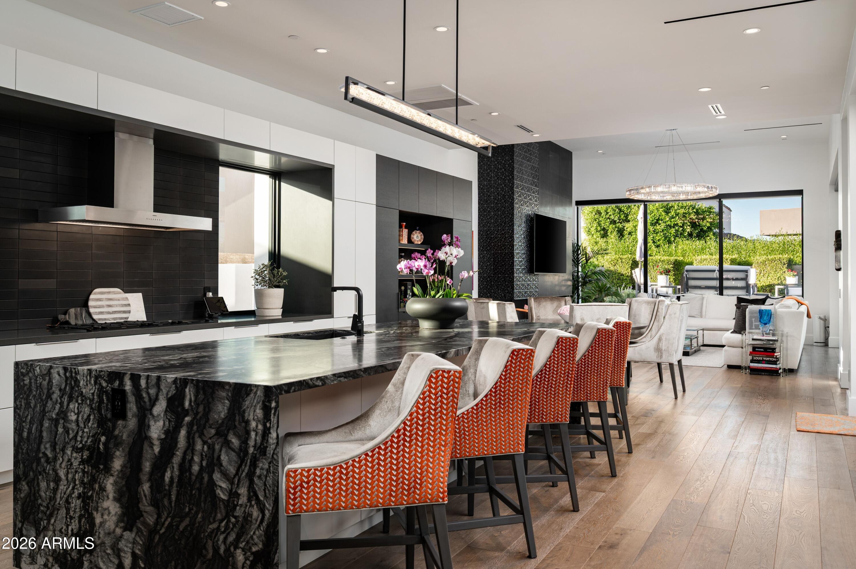 6914 East Cactus Wren Road Paradise Valley, AZ 85253 - Photo 11 of 38 a view of a dining room with furniture window and wooden floor