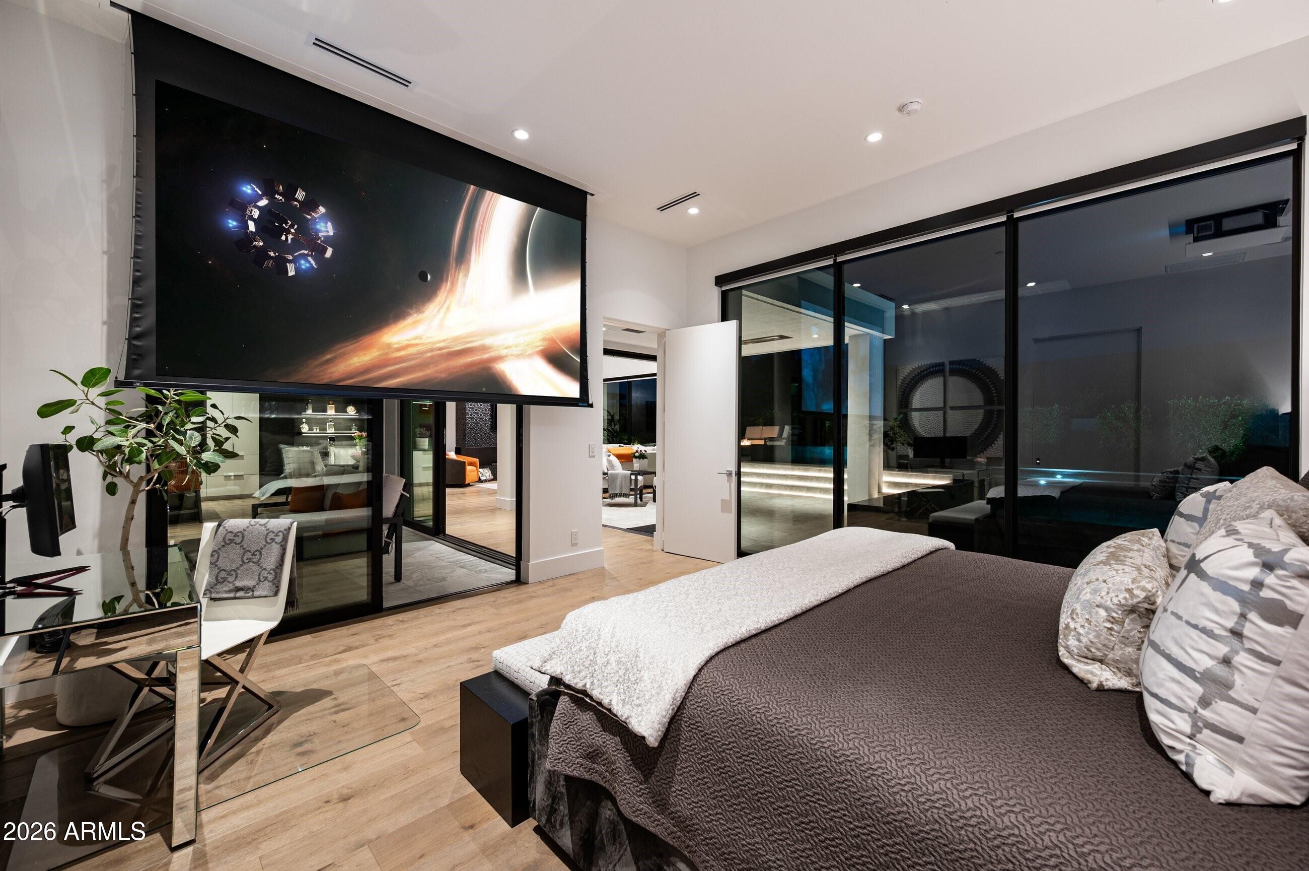 6914 East Cactus Wren Road Paradise Valley, AZ 85253 - Photo 17 of 38 a bedroom with a bed a desk and chair