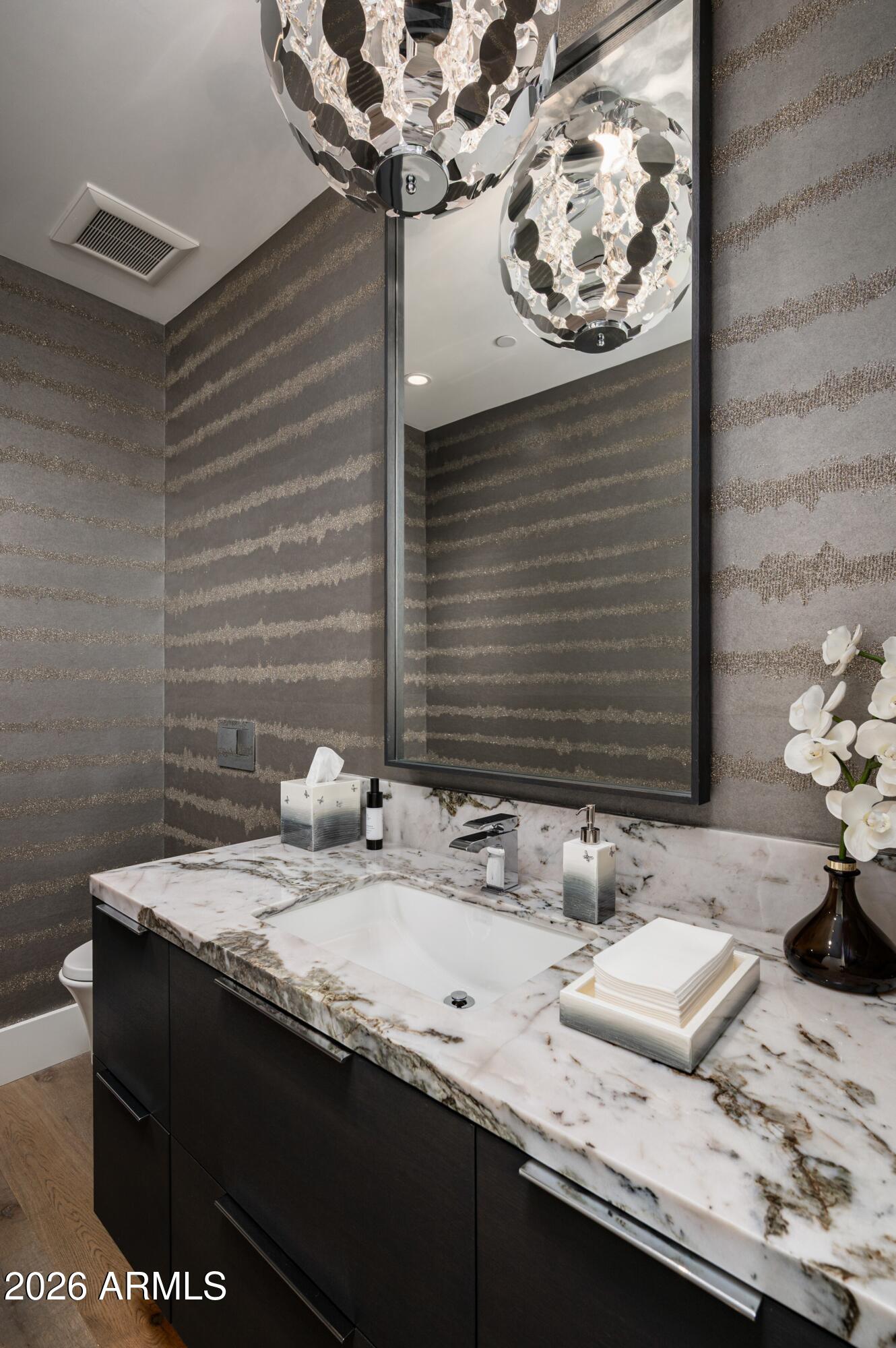 6914 East Cactus Wren Road Paradise Valley, AZ 85253 - Photo 21 of 38 a bathroom with a sink and a mirror