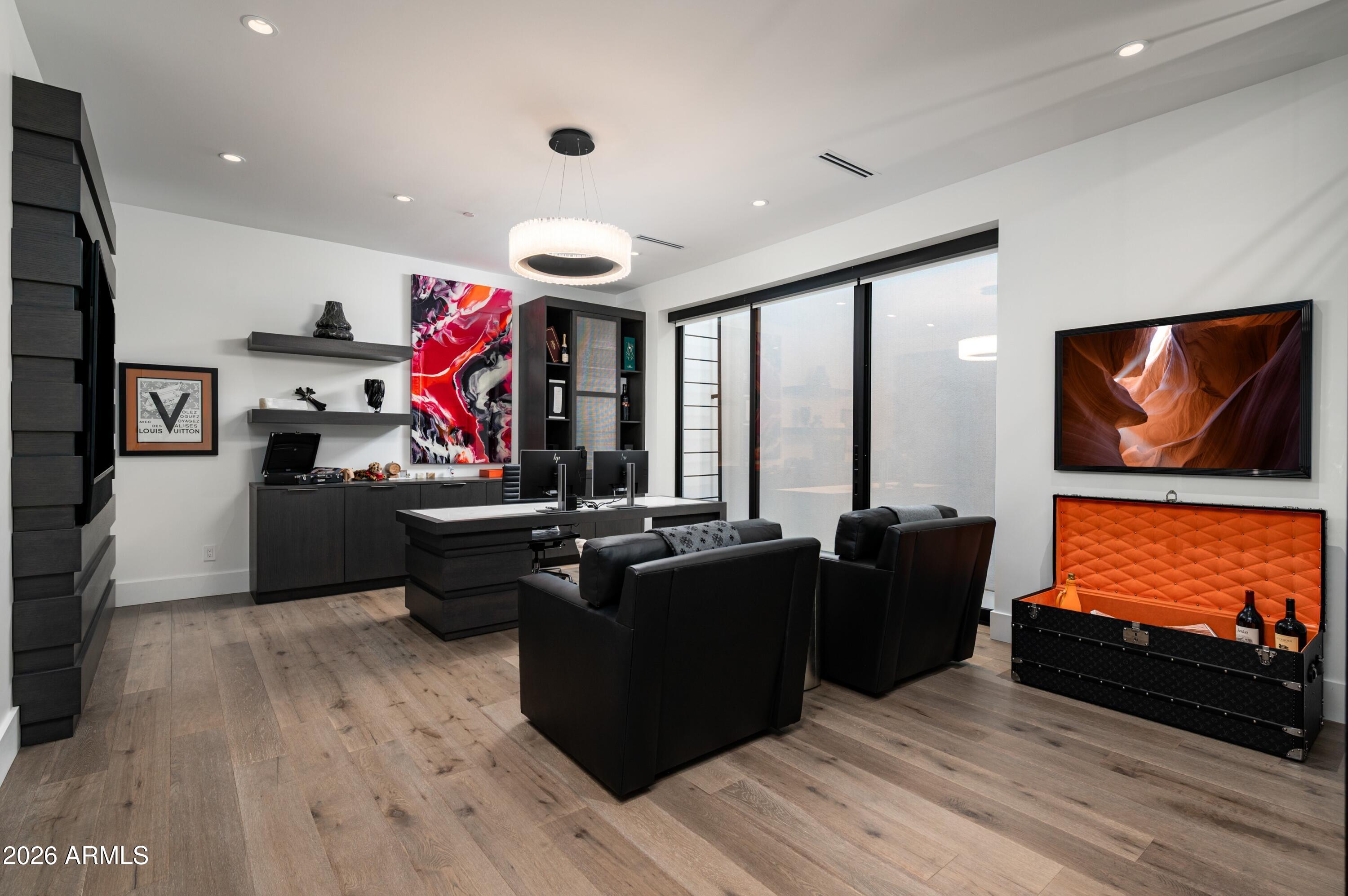 6914 East Cactus Wren Road Paradise Valley, AZ 85253 - Photo 24 of 38 a living room with furniture and a flat screen tv