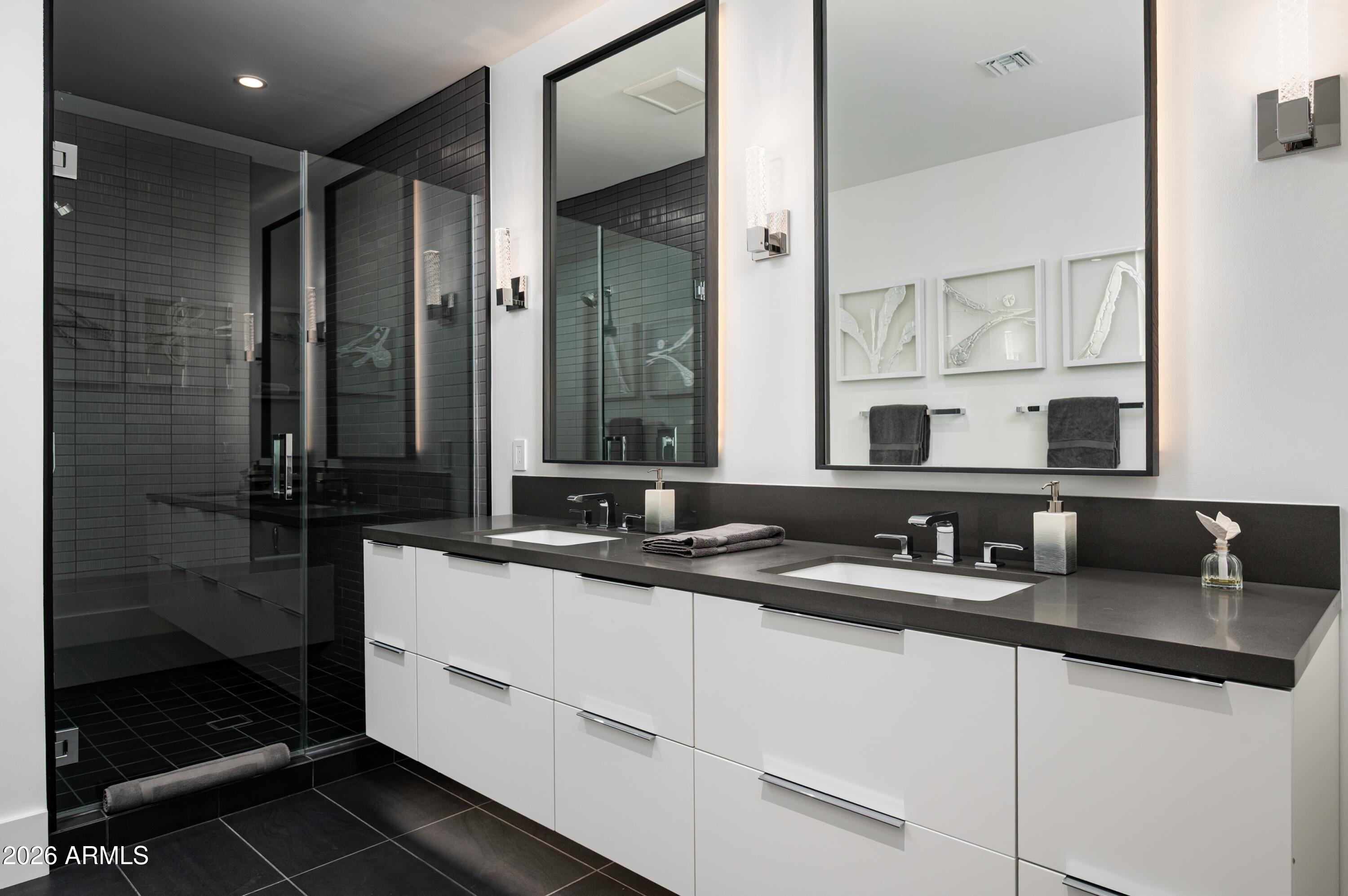 6914 East Cactus Wren Road Paradise Valley, AZ 85253 - Photo 27 of 38 a bathroom with a sink and a mirror