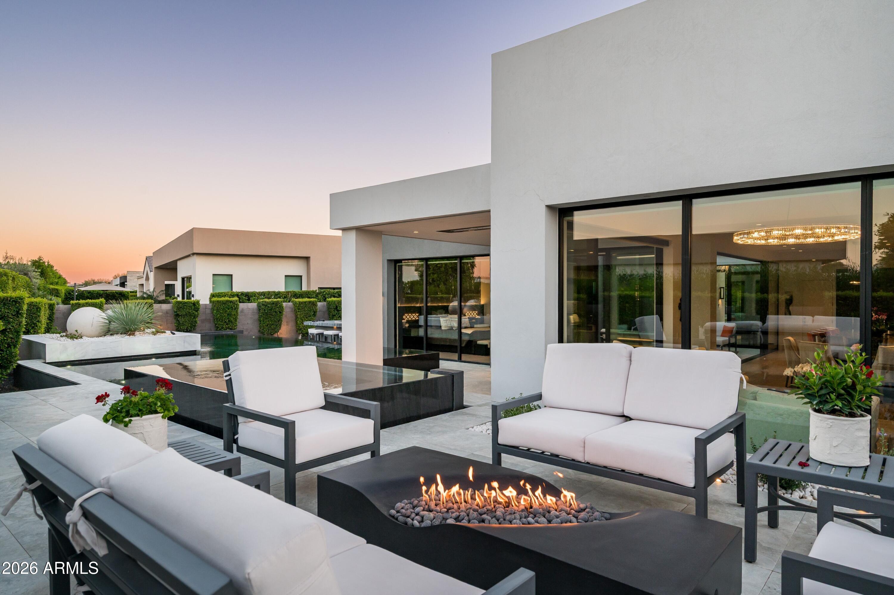 6914 East Cactus Wren Road Paradise Valley, AZ 85253 - Photo 29 of 38 a outdoor living space with furniture and a garden