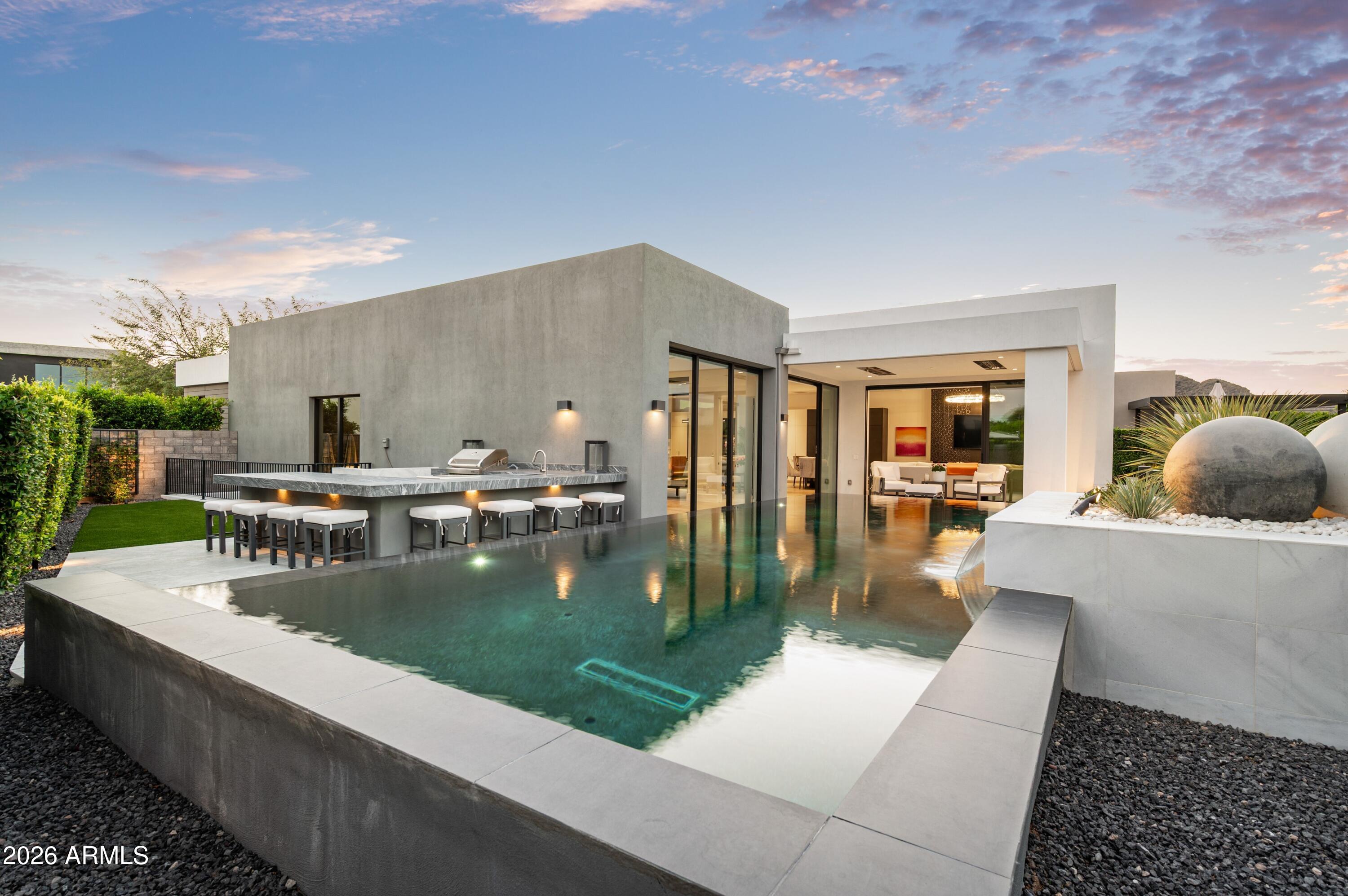 6914 East Cactus Wren Road Paradise Valley, AZ 85253 - Photo 30 of 38 a view of a living room and kitchen
