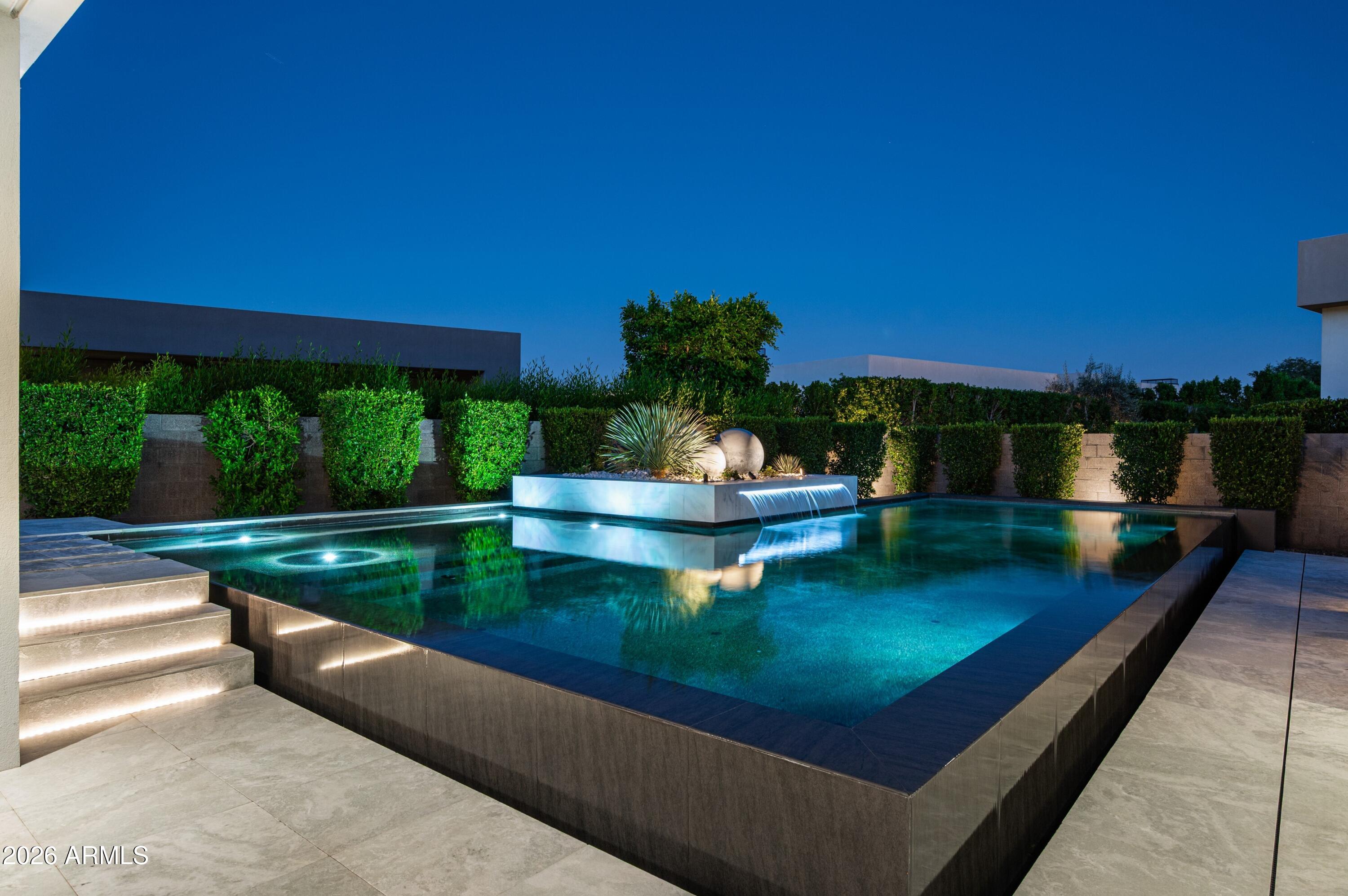 6914 East Cactus Wren Road Paradise Valley, AZ 85253 - Photo 37 of 38 a view of a chairs and table on the deck