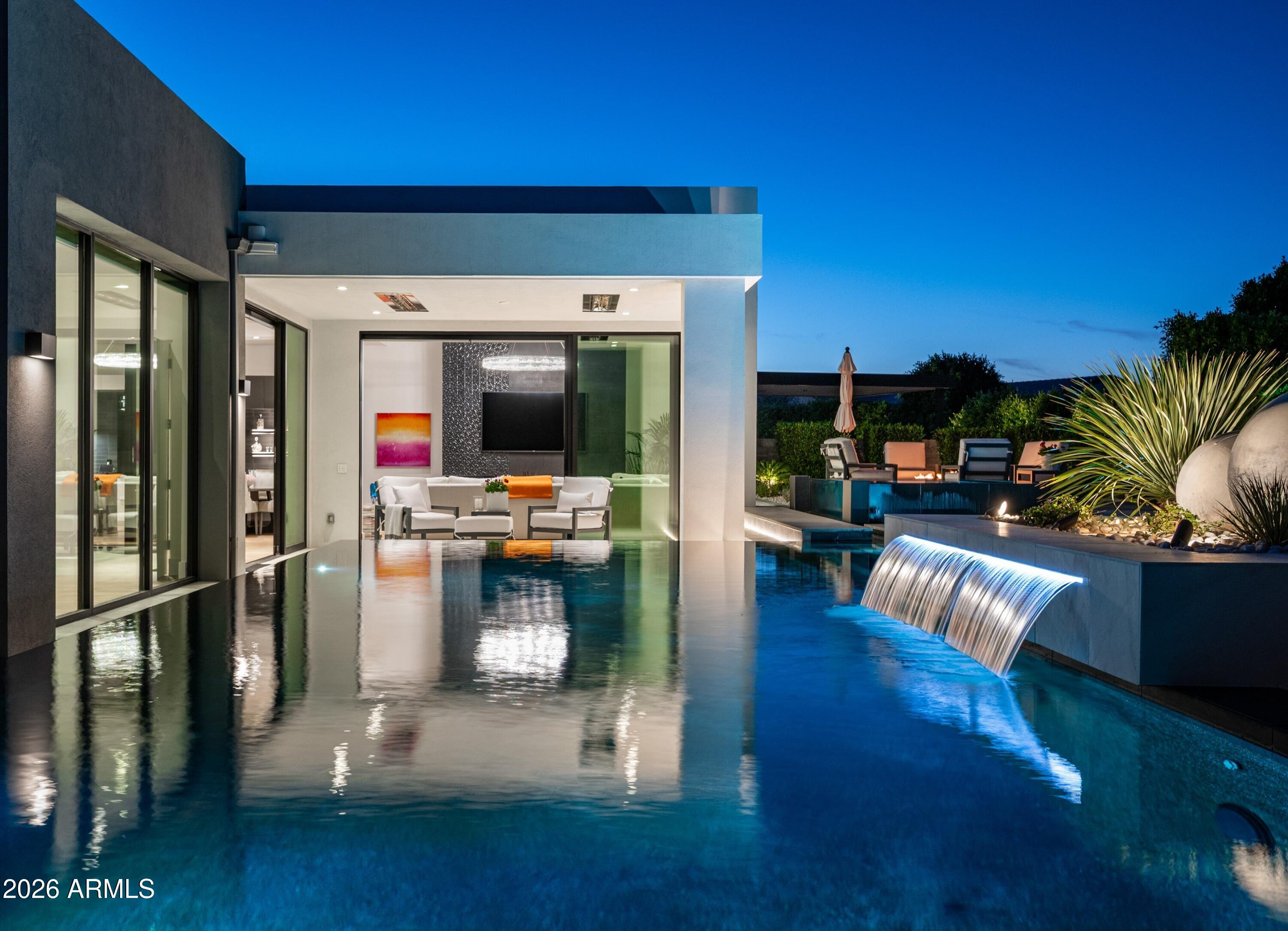 6914 East Cactus Wren Road Paradise Valley, AZ 85253 - Photo 38 of 38 a living room with furniture and a flat screen tv