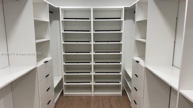 2825 Southwest 79th Court Miami, FL 33155 - Photo 14 of 20 a view of walk in closet with empty racks