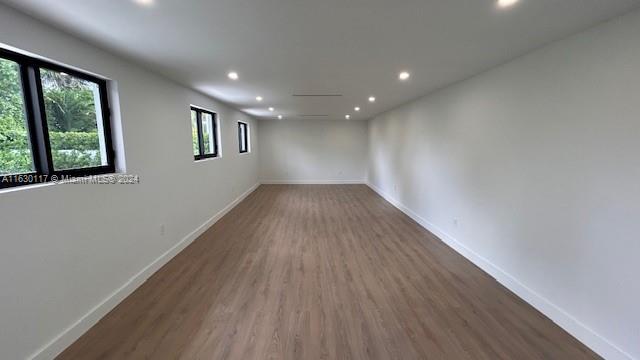 2825 Southwest 79th Court Miami, FL 33155 - Photo 17 of 20 a view of empty room with wooden floor and fan