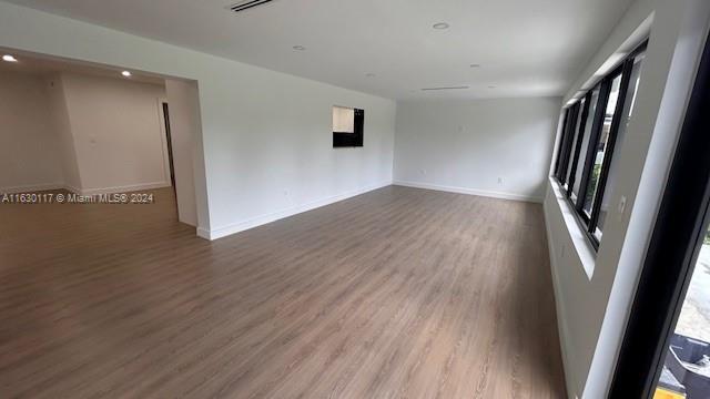 2825 Southwest 79th Court Miami, FL 33155 - Photo 19 of 20 wooden floor in an empty room with a window