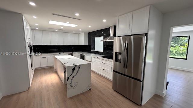 2825 Southwest 79th Court Miami, FL 33155 - Photo 7 of 20 a kitchen with stainless steel appliances a refrigerator a sink a stove a microwave and island
