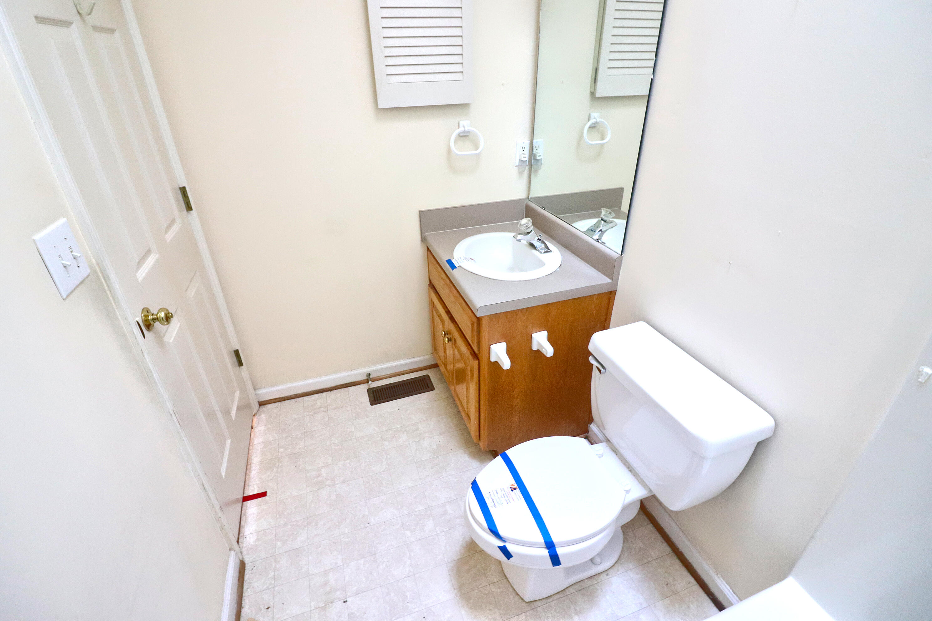5630 Spring Meadow Drive Roanoke, VA 24018 - Photo 18 of 19 a bathroom with a toilet sink and mirror