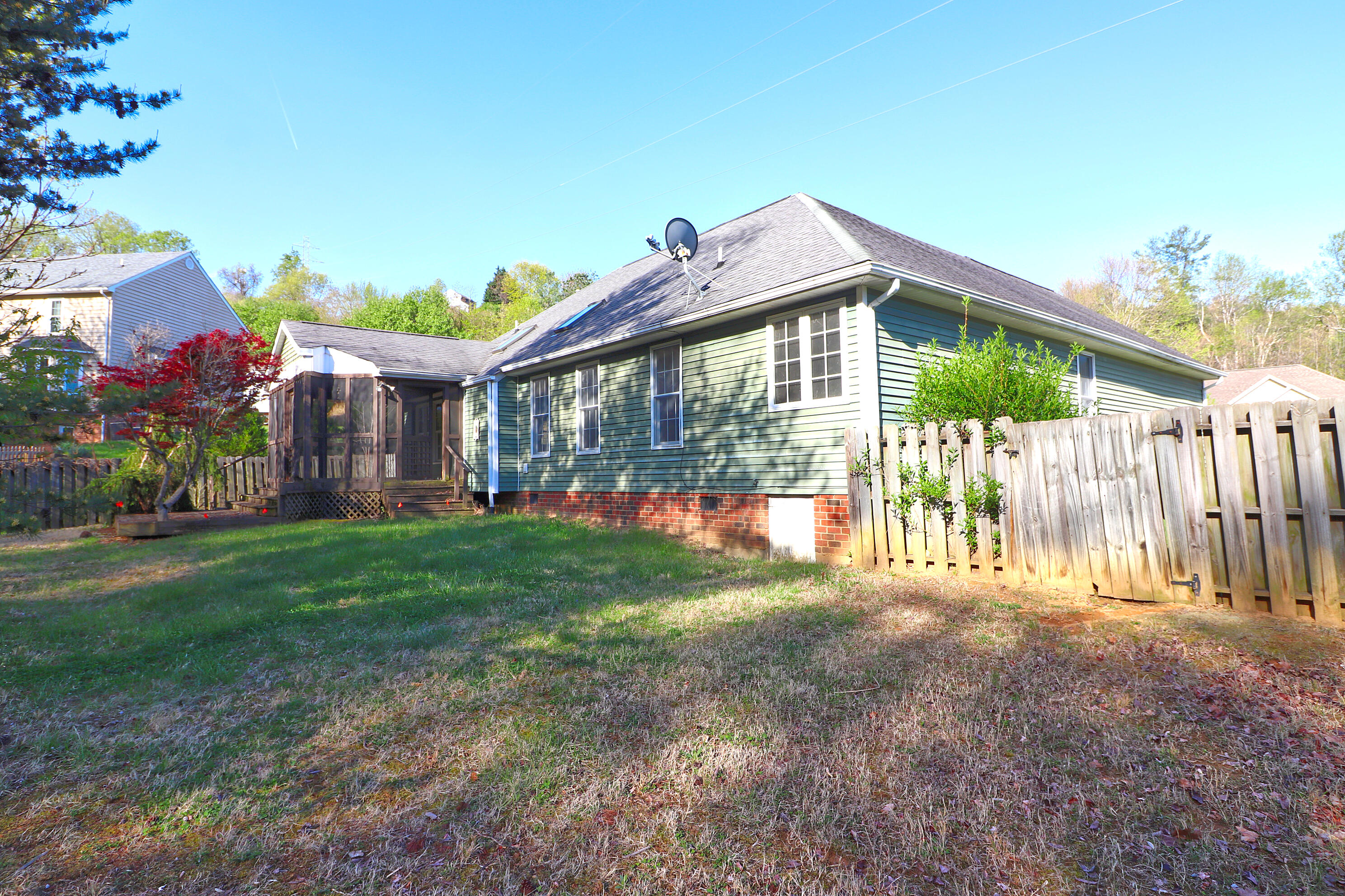 5630 Spring Meadow Drive Roanoke, VA 24018 - Photo 3 of 19 a front view of a house with a yard and garden