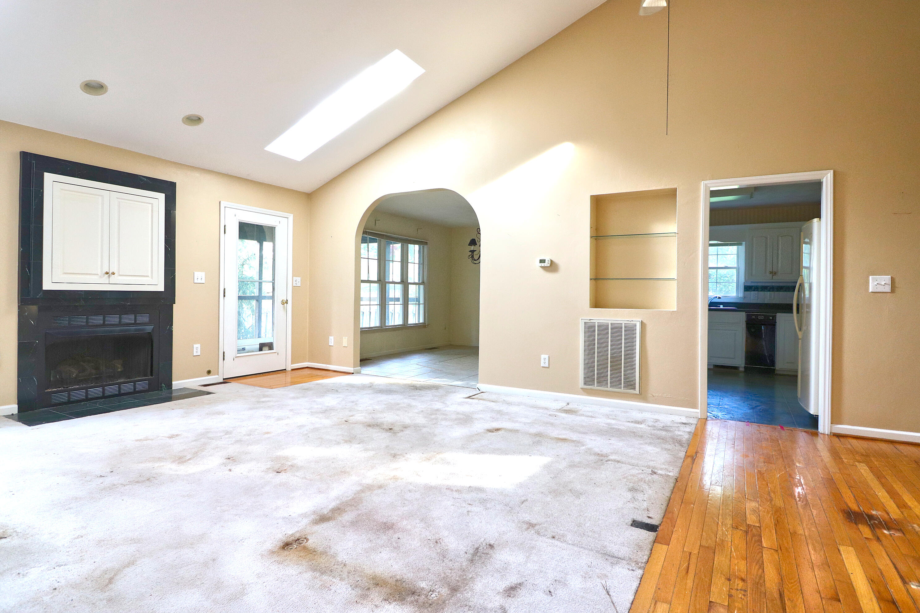 5630 Spring Meadow Drive Roanoke, VA 24018 - Photo 5 of 19 a view of an empty room with kitchen and a window