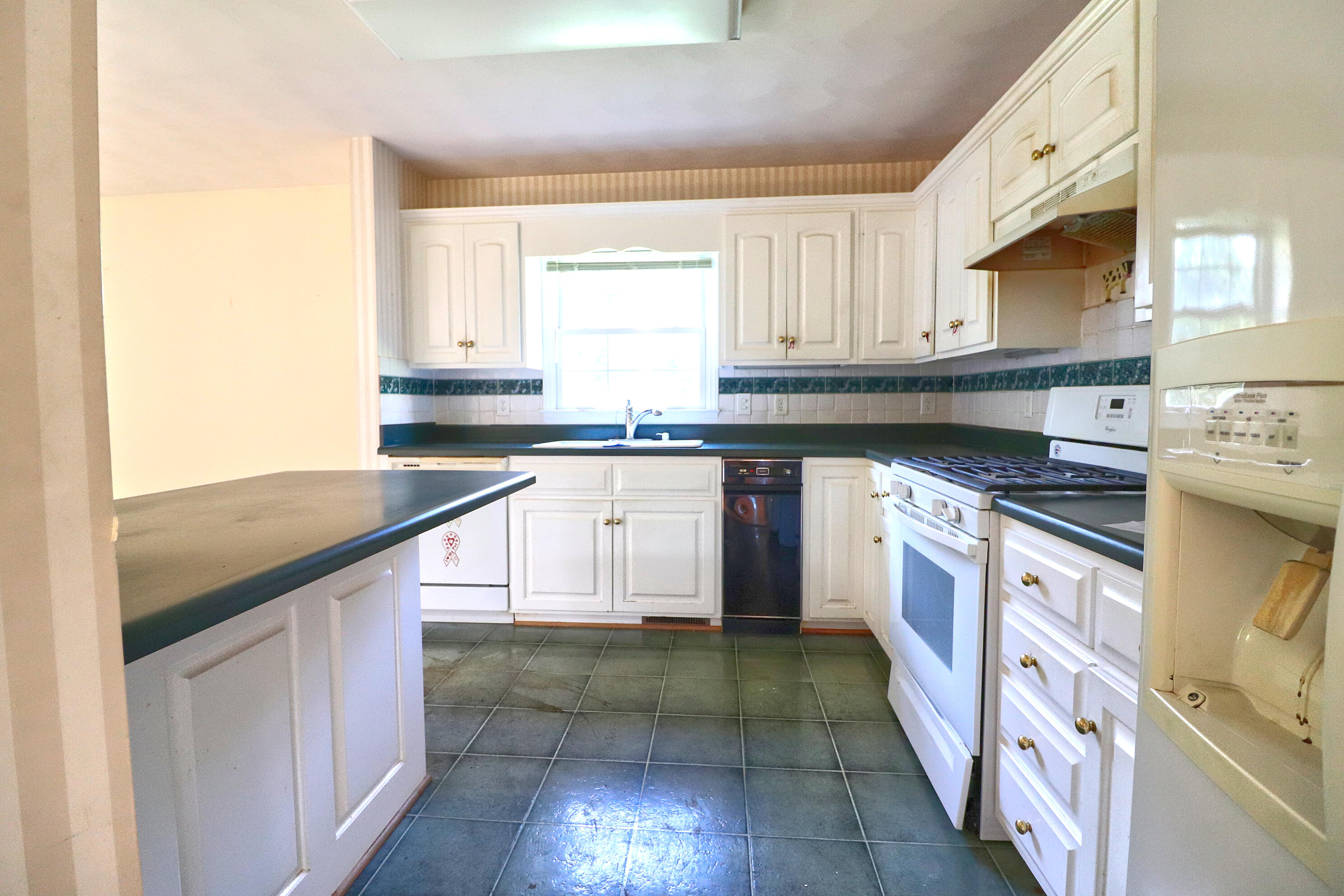 5630 Spring Meadow Drive Roanoke, VA 24018 - Photo 9 of 19 a kitchen with stainless steel appliances granite countertop a sink and a stove