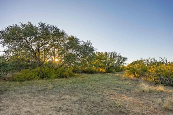 a view of a lake with a big yard