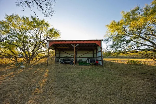 a view of a chairs and table in the patio