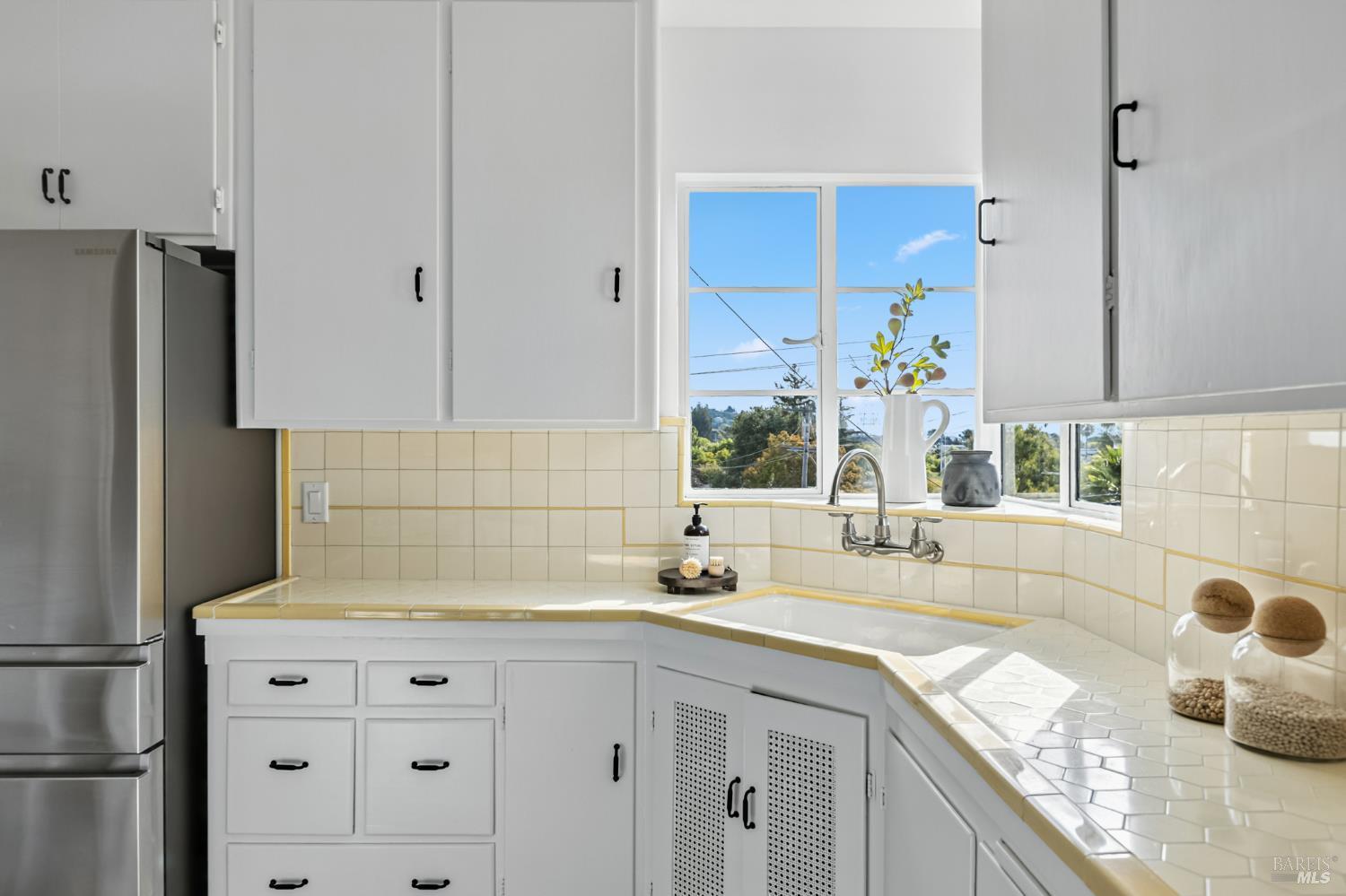 21 Marina Boulevard San Rafael, CA 94901 - Photo 11 of 38 a kitchen with granite countertop stainless steel appliances a sink stove and refrigerator