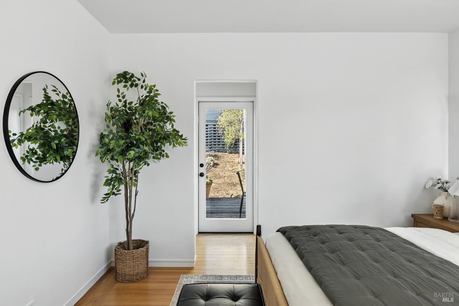 21 Marina Boulevard San Rafael, CA 94901 - Photo 16 of 38 a bedroom with a bed and a potted plant