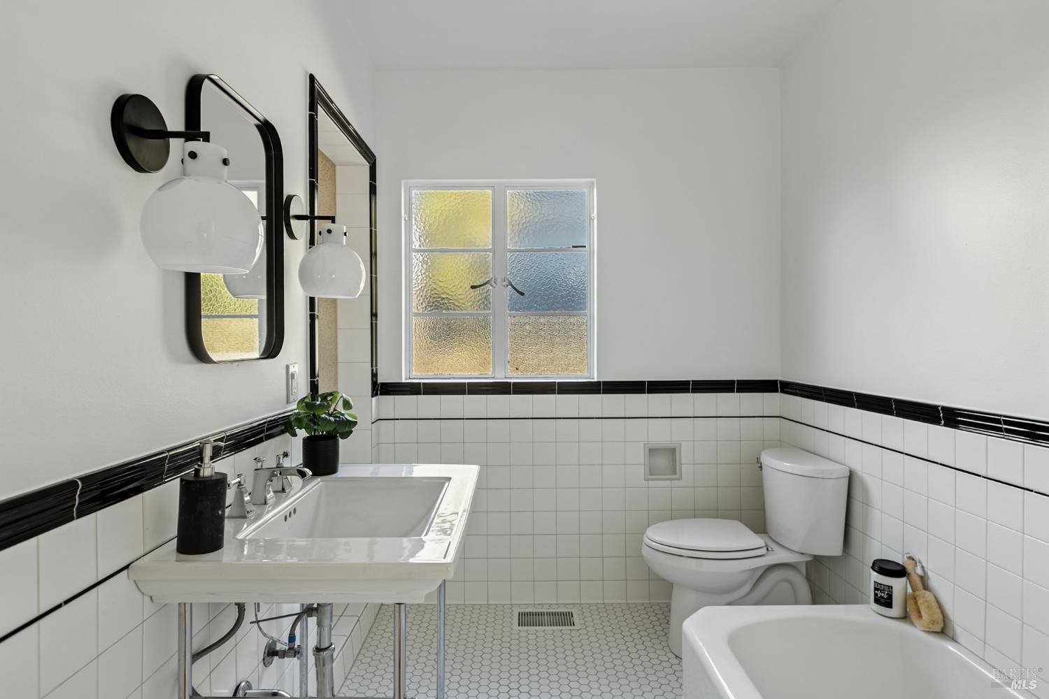 21 Marina Boulevard San Rafael, CA 94901 - Photo 19 of 38 a bathroom with a toilet sink and mirror