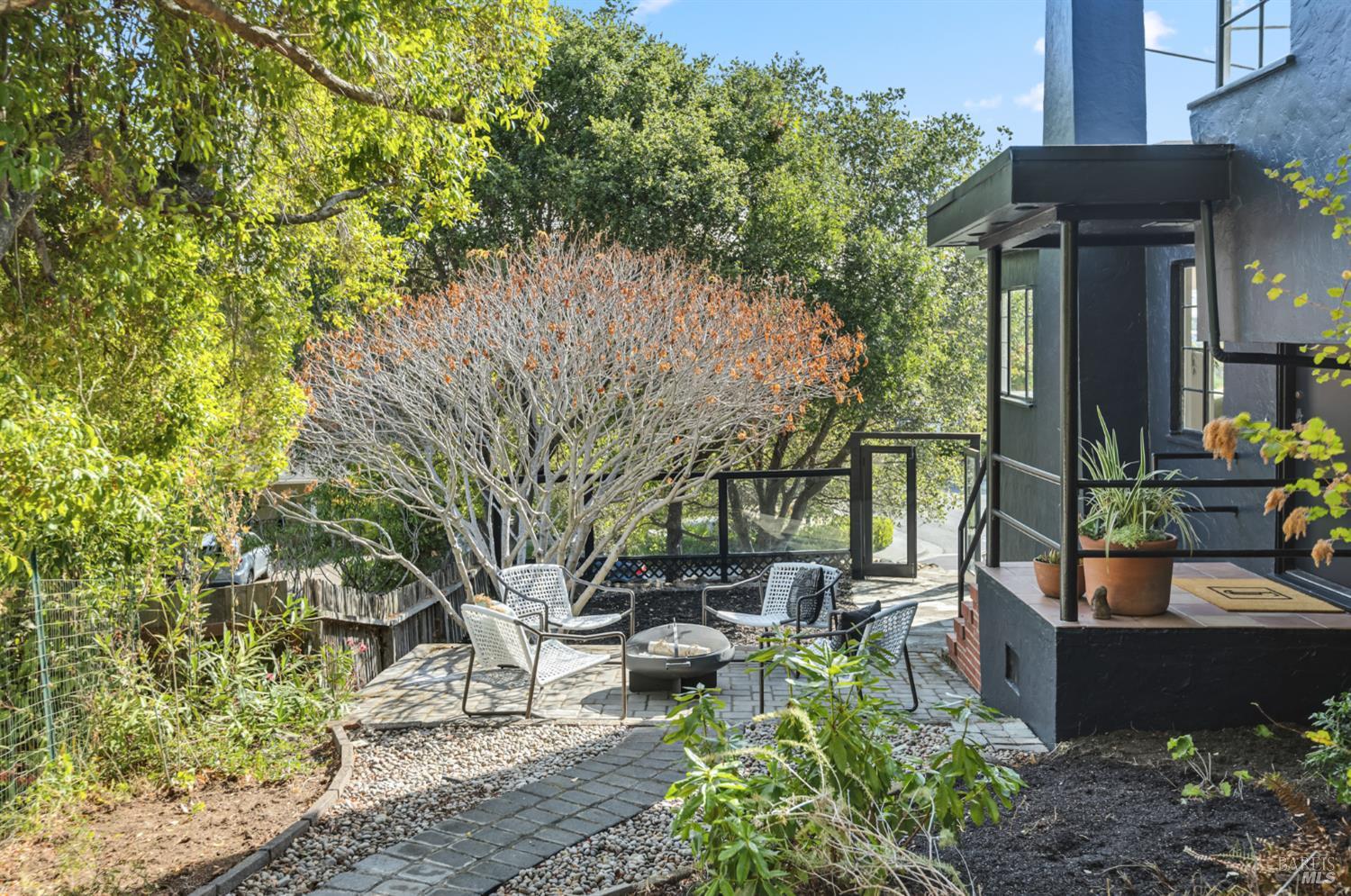 21 Marina Boulevard San Rafael, CA 94901 - Photo 26 of 38 a view of a patio with table and chairs and potted plants