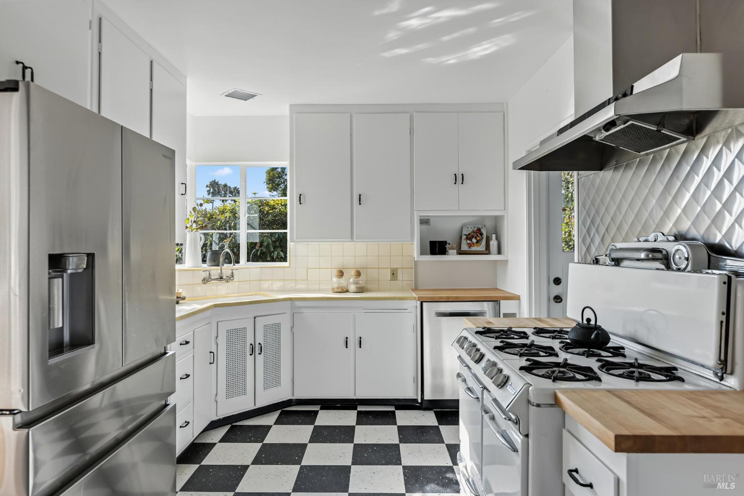 21 Marina Boulevard San Rafael, CA 94901 - Photo 10 of 38 a kitchen with stainless steel appliances a stove a sink and a refrigerator