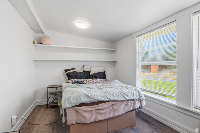 4270 River Road Oakley, UT 84055 - Photo 23 of 46 Compact room featuring wood-finish flooring, white walls, and a large window with horizontal blinds