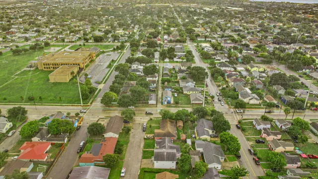 an aerial view of residential houses with outdoor space