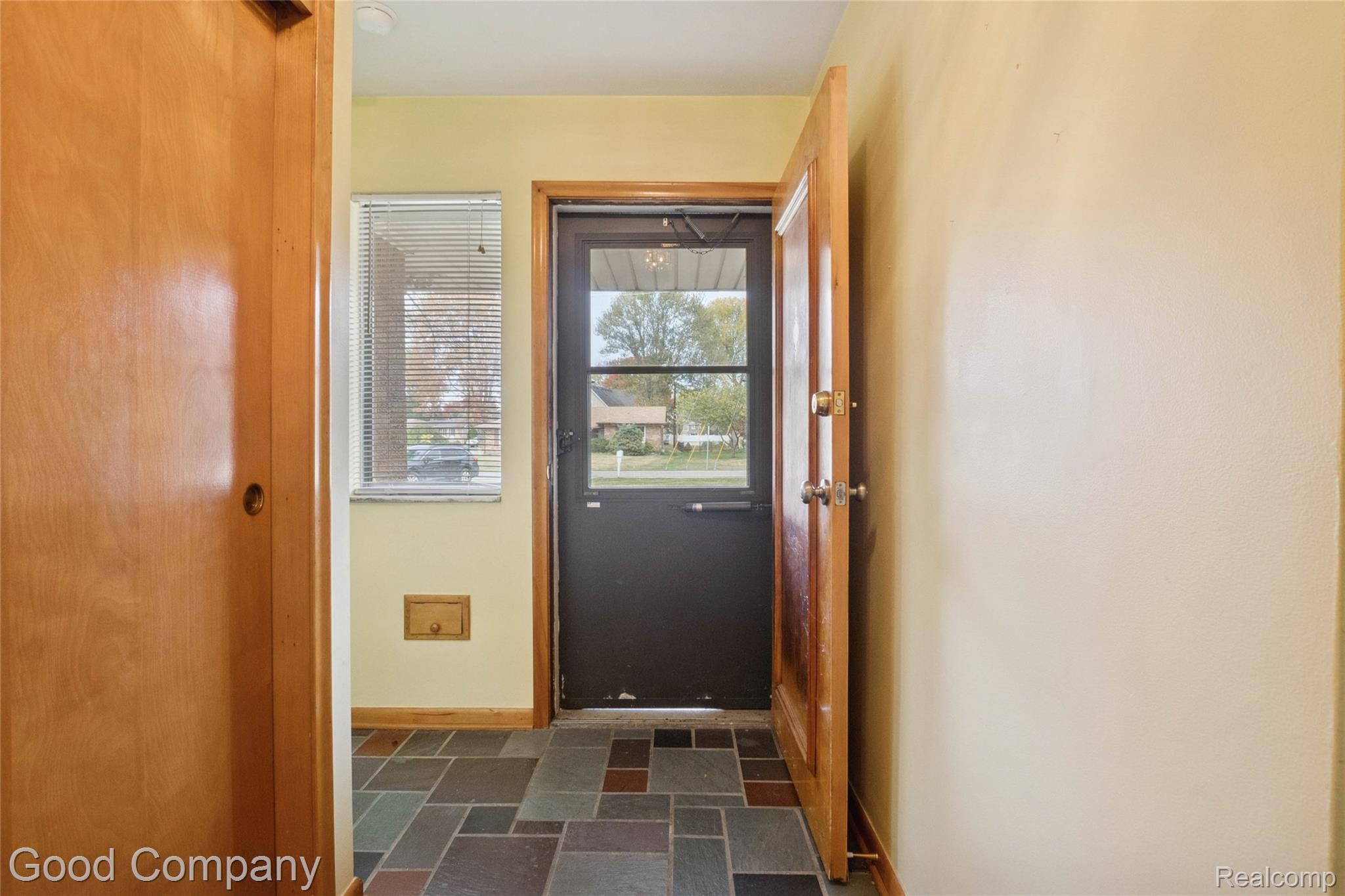 33920 Mulvey Road Fraser, MI 48026 - Photo 3 of 49 Doorway with baseboards and stone tile floors