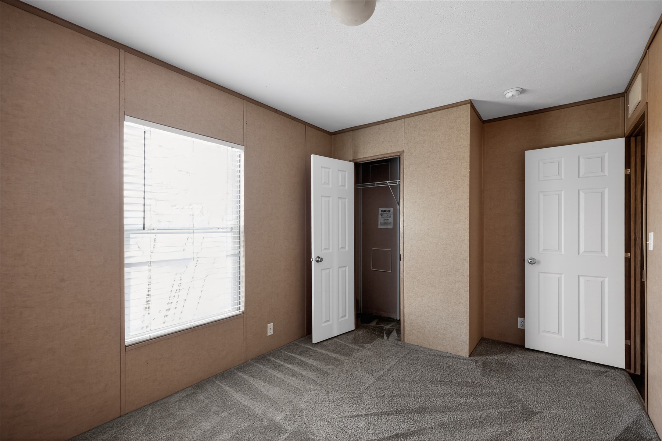 2674 Cotton Gin Road Kyle, TX 78640 - Photo 23 of 30 Unfurnished bedroom with carpet floors, a closet, and ornamental molding
