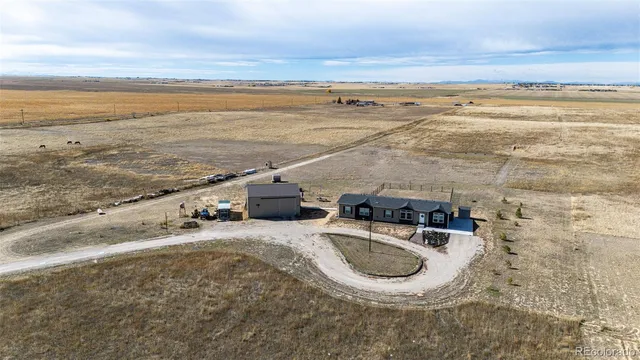 $705,000 | 977 South County Road 149, Strasburg, CO 80136