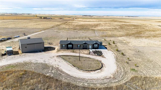 $705,000 | 977 South County Road 149, Strasburg, CO 80136