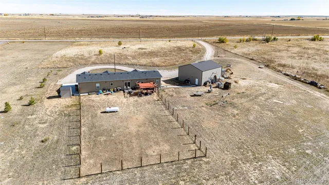 $705,000 | 977 South County Road 149, Strasburg, CO 80136
