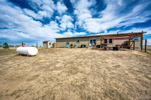 $705,000 | 977 South County Road 149, Strasburg, CO 80136