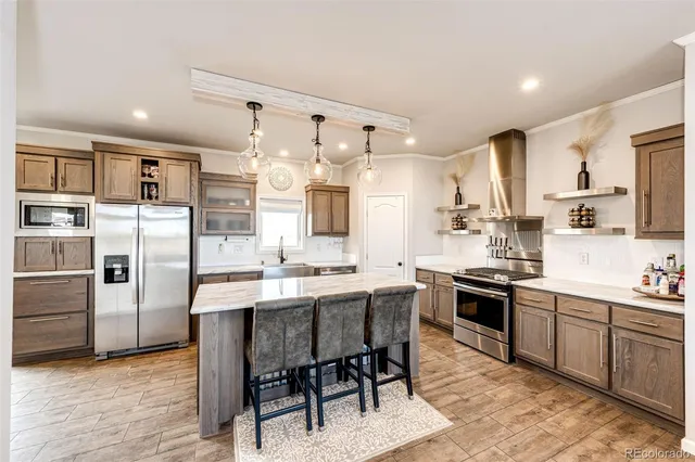 $705,000 | 977 South County Road 149, Strasburg, CO 80136