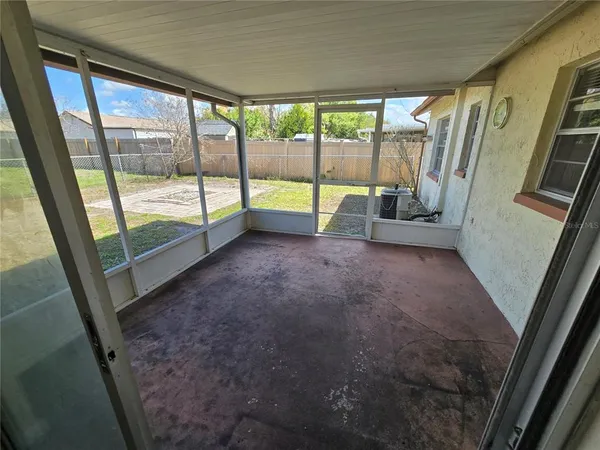 a view of an empty room with a fireplace