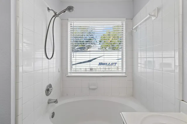 a bathroom with a sink vanity and a mirror