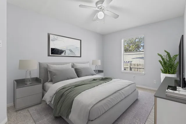 a bathroom with a bath tub with a shower